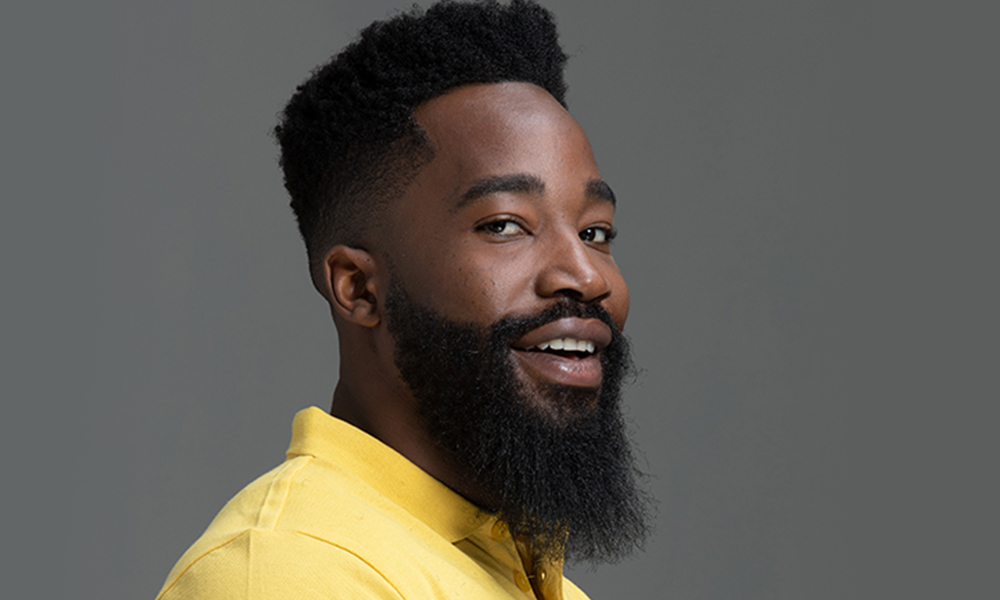 African man with neatly trimmed hair and long beard