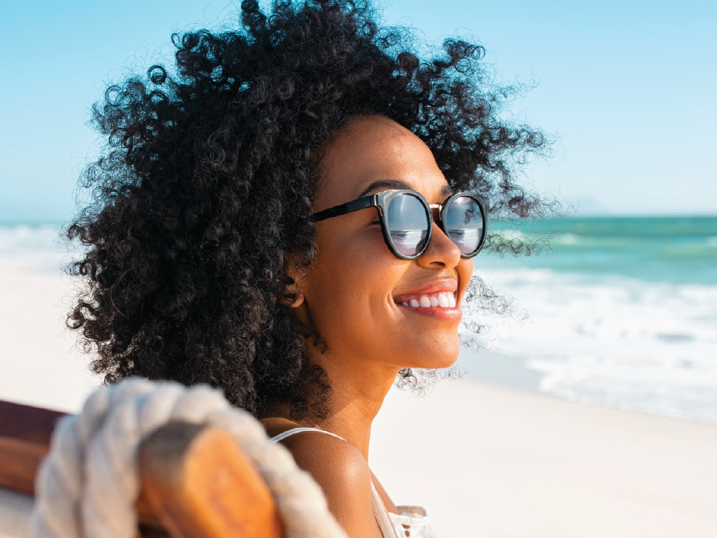Lady with afro hair on the beach