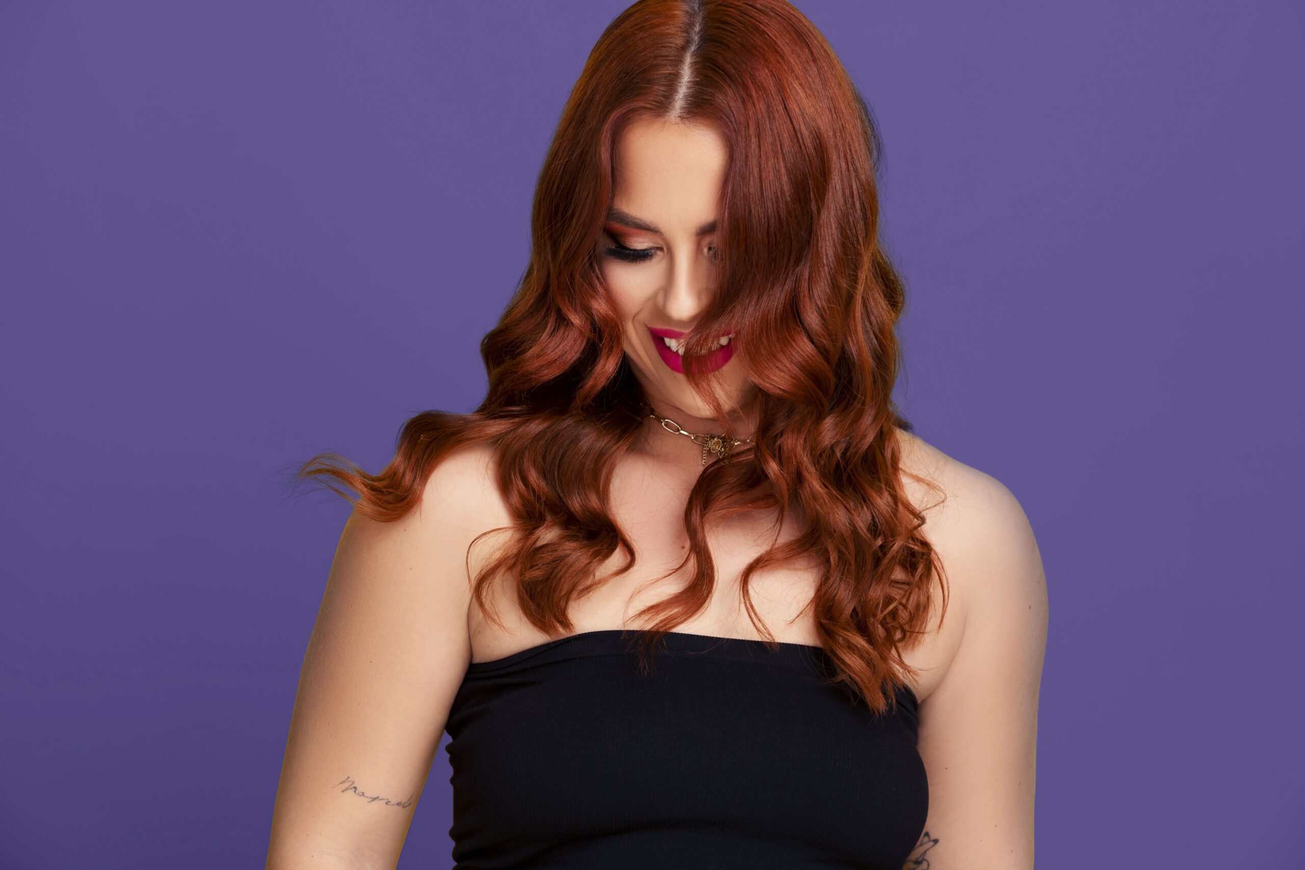 Lady with long red hair and red lipstick